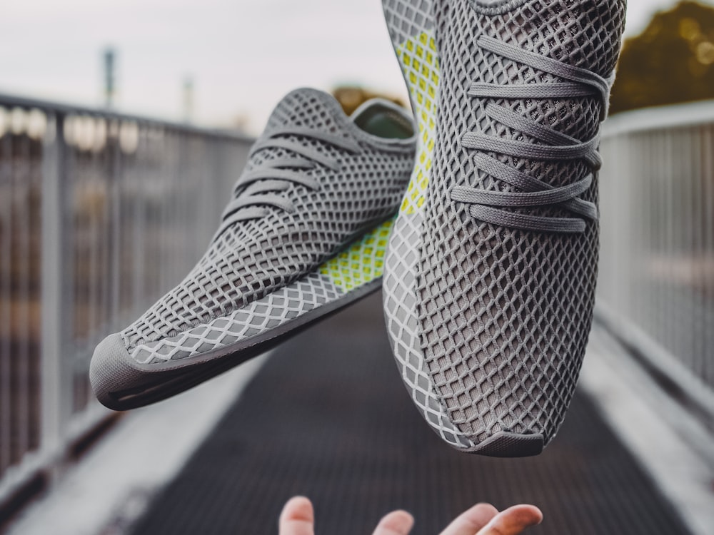 BegaStep Knit Runner in graphite mesh, pair held up